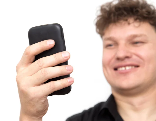 Uomo con telefono su sfondo bianco — Foto Stock