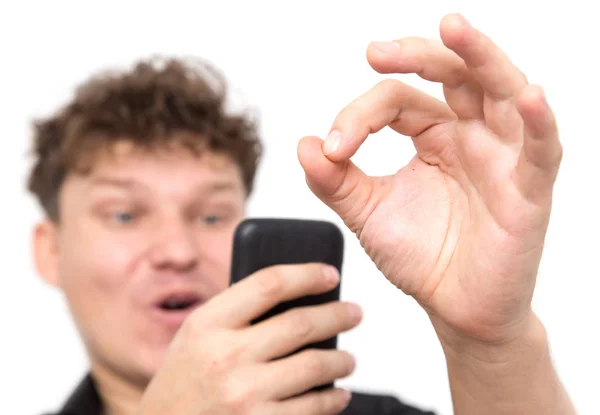 Homem com telefone em um fundo branco — Fotografia de Stock