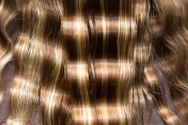 Vågigt hår som bakgrund. konsistens — Stockfoto
