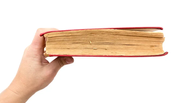 Oud boek in zijn hand op een witte achtergrond — Stockfoto