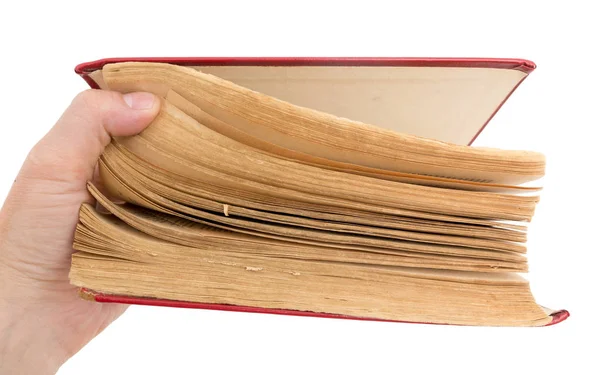 Старая книга в руке на белом фоне — стоковое фото
