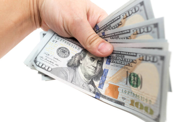 Dollars in hand on a white background
