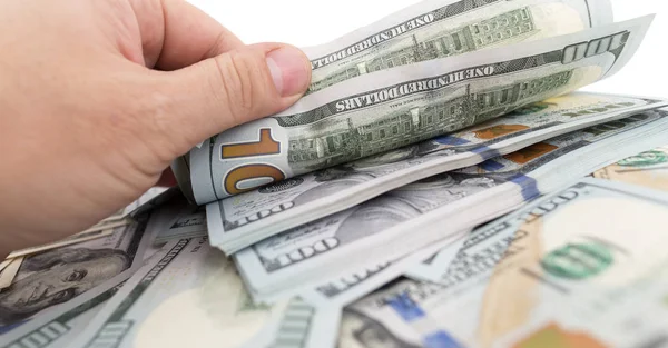 Dólares na mão sobre um fundo branco — Fotografia de Stock