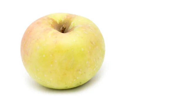 Желтое яблоко на белом фоне — стоковое фото