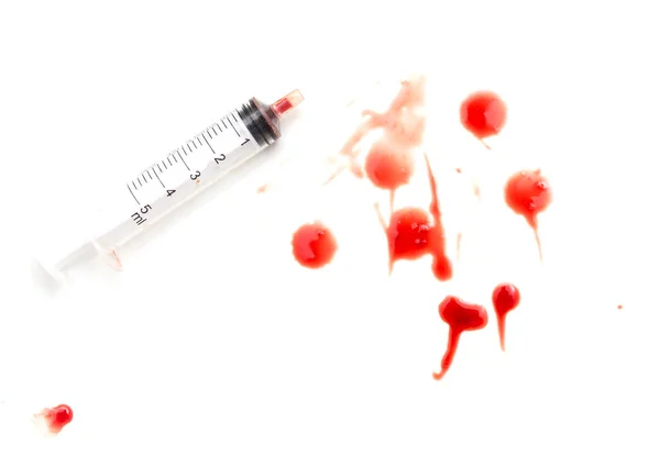 Syringe and red blood on white background — Stock Photo, Image