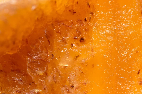 Pulp ripe persimmons as a background. macro — Stock Photo, Image