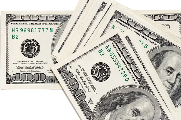 Dólares em um fundo branco — Fotografia de Stock