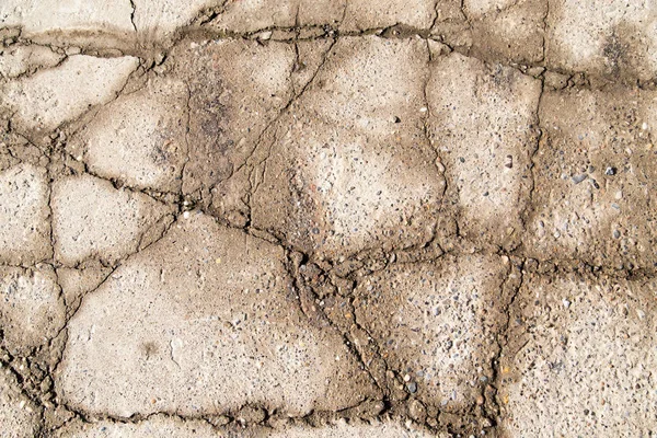 Gebarsten betonnen muur als achtergrond. textuur — Stockfoto