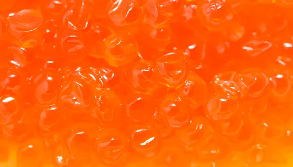 Caviar vermelho como fundo. macro — Fotografia de Stock