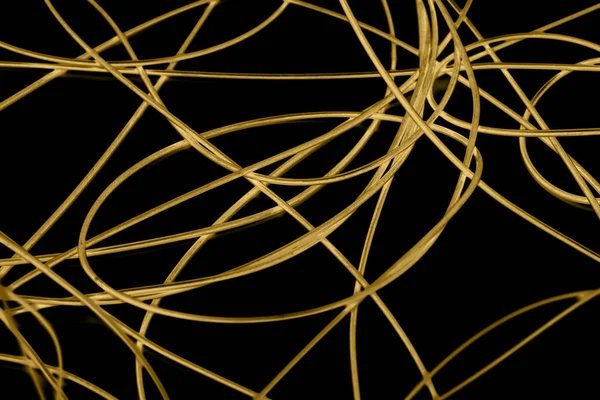 Yellow cable on the black background. The inversion — Stock Photo, Image