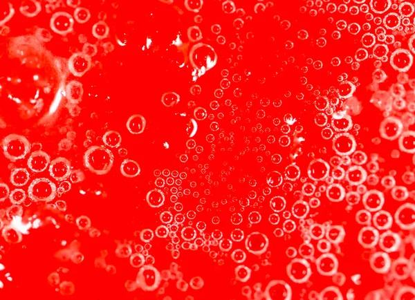 Drops of honey on a red background — Stock Photo, Image