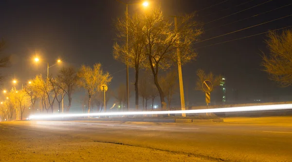 Road at night with moving cars — Stock Photo, Image
