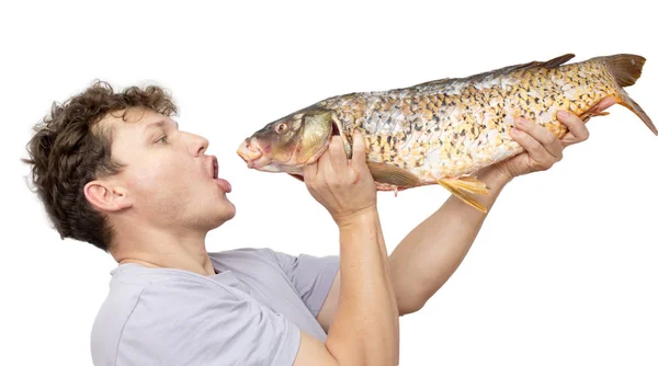 Big carp in his hand on a white background — Stock Photo, Image