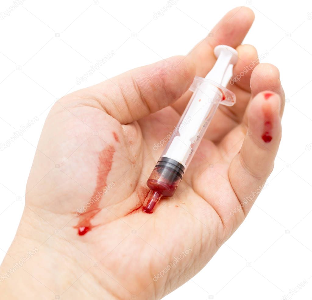 syringe in hand on white background