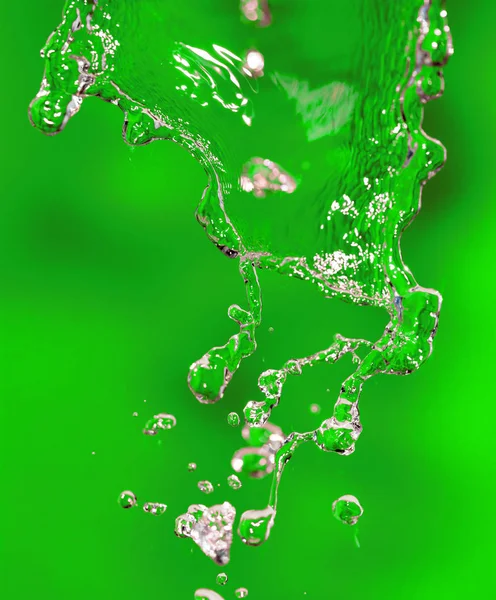 Splashes of water on a green background — Stock Photo, Image