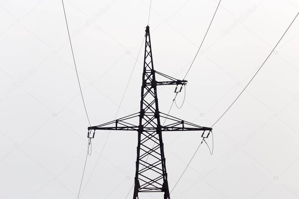 electric pole on the background of the cloudy sky