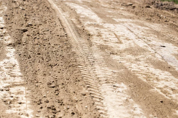 A trace of the machine on the ground as a background — Stock Photo, Image