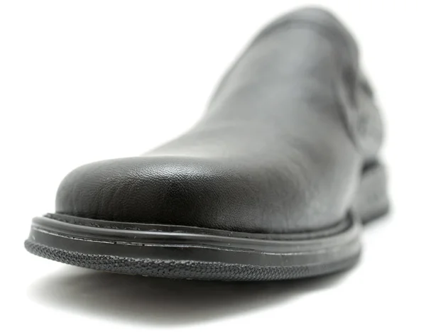 Zwarte schoenen op een witte achtergrond — Stockfoto