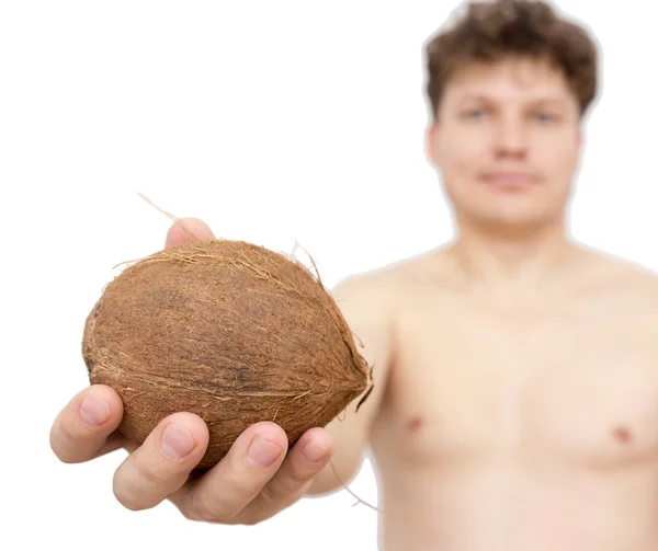 Kokos in een Mans hand op een witte achtergrond — Stockfoto