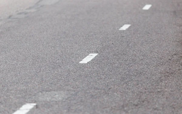 Marcações na estrada como um fundo. textura — Fotografia de Stock