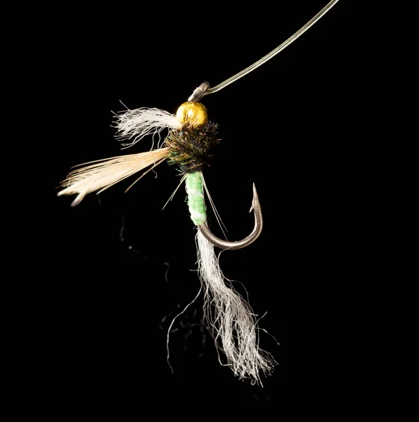 Fly to catch fish on a black background — Stock Photo, Image