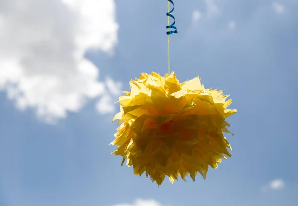 Yellow bow on a background of blue sky — Stock Photo, Image