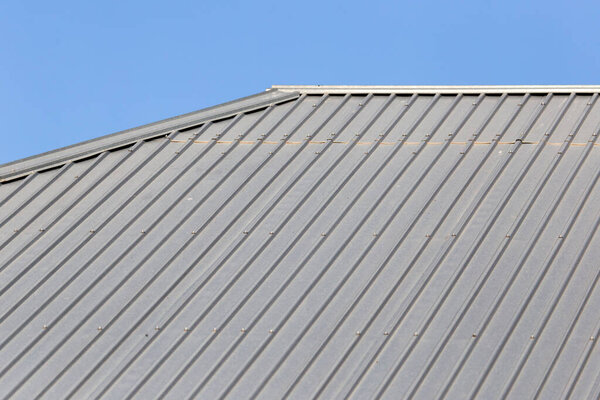 Metal roofing roof as background . Photo of an abstract texture