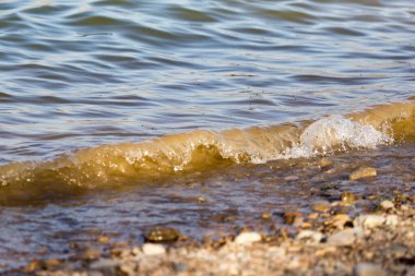 Sahilde arka plan olarak dalga .