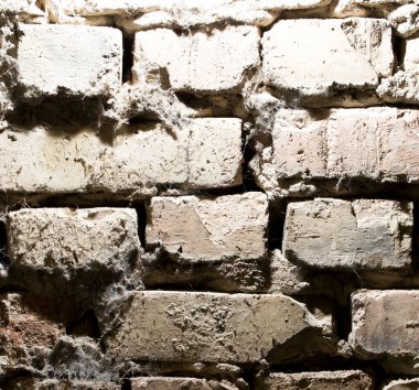 Soyut arka plan eski tuğla duvar. Soyut bir dokunun fotoğrafı