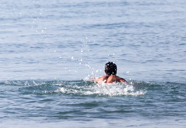 Man Bathes Lake Beach Stock Photo