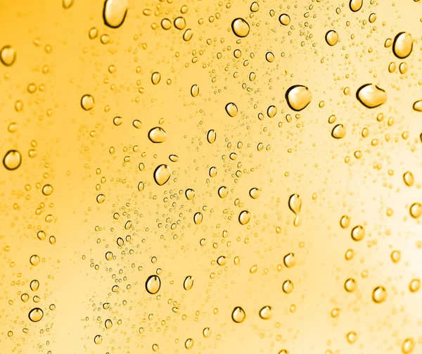 Gotas Agua Dorada Sobre Vidrio Foto Una Textura Abstracta — Foto de Stock