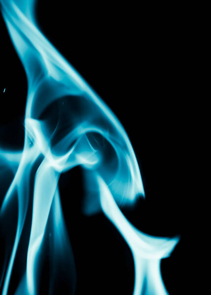 Abstract background of blue flame fire on black background .