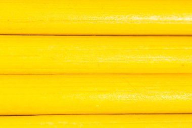 Arka plan olarak sarı kalemler. Soyut bir dokunun fotoğrafı