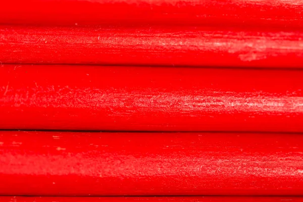 Arka plan olarak kırmızı kalemler. Soyut bir dokunun fotoğrafı