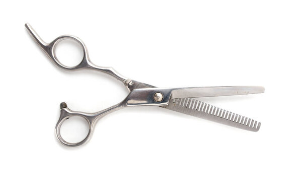 Thinning scissors on a white background . Photos in the studio