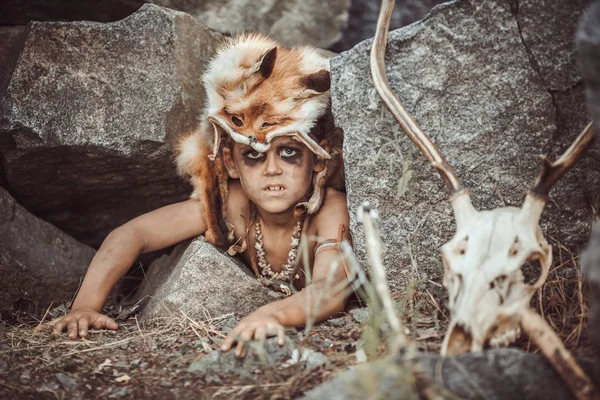 Caveman, manly boy hunting outdoors. Ancient warrior portrait. — Stock Photo, Image