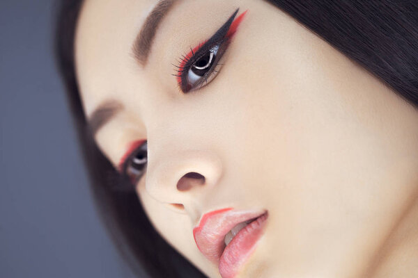 Asian beauty woman with creative make-up. Close-up portrait.