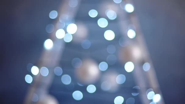 Abstract blurred blue bokeh background of garland — Stock Video