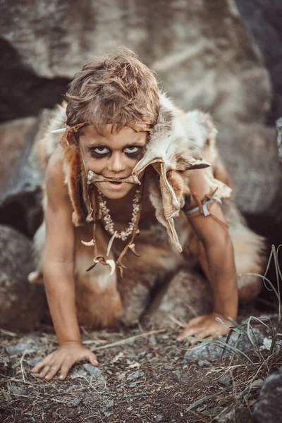 Caveman, manly boy hunting outdoors. Ancient warrior portrait. — Stock Photo, Image