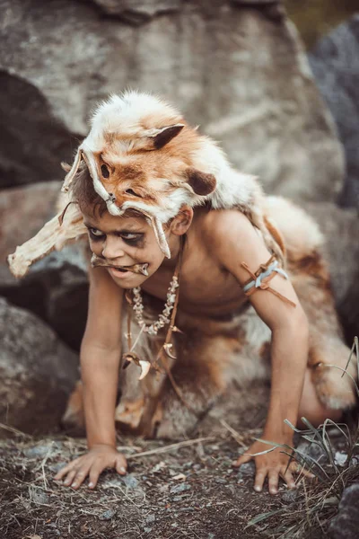 Caveman, manly boy hunting outdoors. Ancient warrior portrait. — Stock Photo, Image