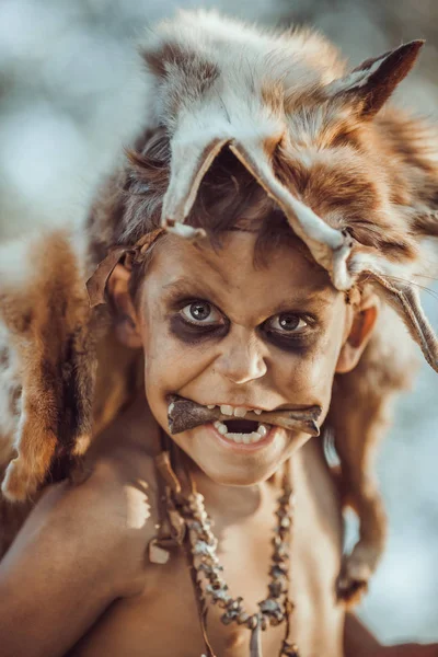 Angry funny caveman boy portrait. — Stock Image Angry funny caveman boy portrait. Stock Photo