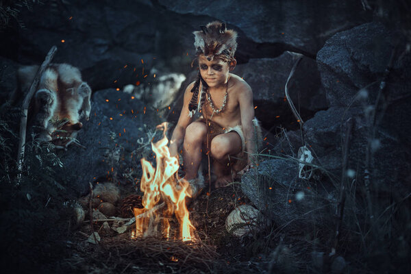 Shamans boy at the fire