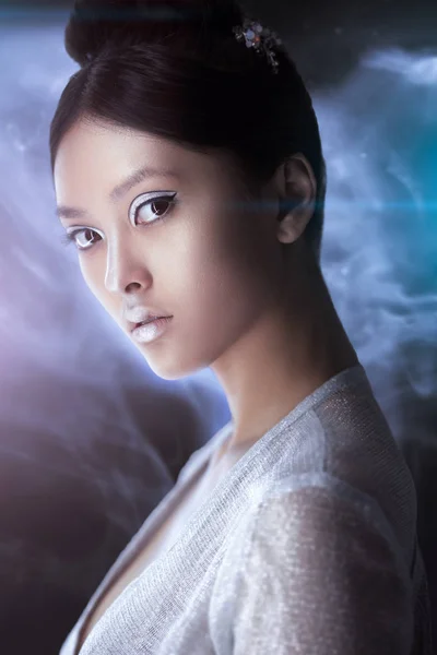 Shot of a futuristic young asian woman. — Stock Photo, Image