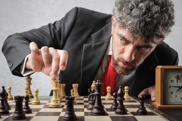 Curly Haired Man Playing Chess Looking Seriously — Stock Photo, Image