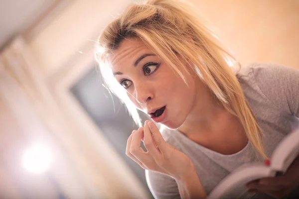 Young Blonde Woman Eating Biscuit Reading Book Bed Morning — Stock Photo, Image