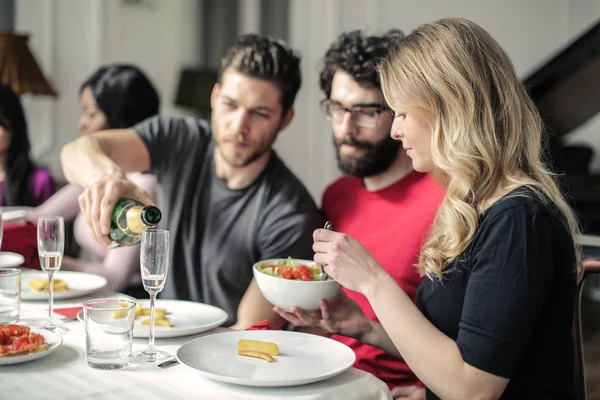 Group of friends having dinner at home.