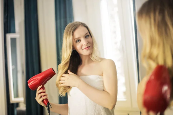 Young Beautiful Blonde Woman Drying Her Hair Home — Stock Photo, Image