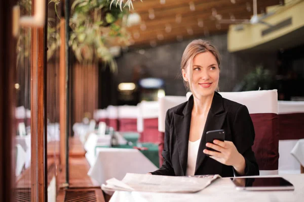 Blonde woman in a restaurant.