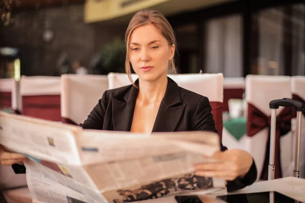 Blonde woman in a restaurant.