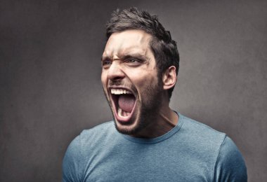 Man shouting angrily indoor. clipart